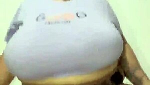 Curvy Latina woman showcases her massive tits in a subtle display.