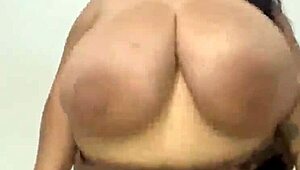 Curvy Latina woman showcases her massive tits in a subtle display.