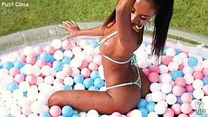 putri cinta in a paddling pool film, looking so relaxed