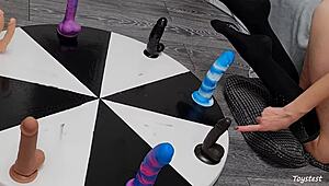 She spins the wheel of dildos to win her orgasm