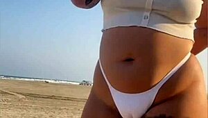 Redhead Flashes Swollen Pussy Lips on Beach