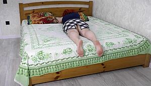 The stepmom says, 'lie down on the bed so I can have sex with you'