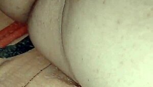 Mature woman at home plays with her dildo