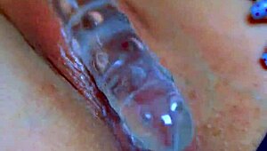 Watch that puffy pussy take a glass dildo!