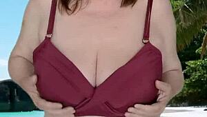 I saw this hot granny with huge tits teasing in her bikini, oh man!