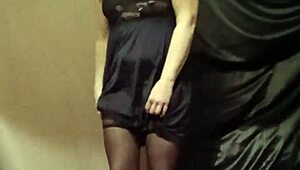 Female slave indulges in solo striptease session with toys and bondage in homemade outdoor setting