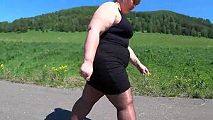 Mature bbw in nylon pantyhose and high heels walks public road. Foot fetish big booty asmr.