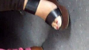 Mature feet candidly shown in wedges and sandals