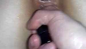 This sexy brunette amateur is exploring wild anal fun with toys in her homemade setup