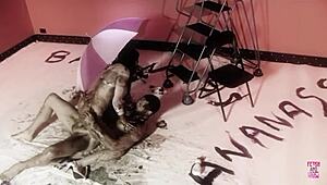 A naughty brunette and her man play with dark oil and fuck doggy style?