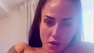 Tattooed brunette plays with dildos in tight pussy