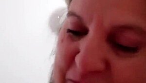 mature woman gives intriguing handjob during massage session