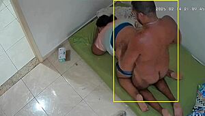 Hidden camera catches wife cheating with neighbor, humiliating husband.