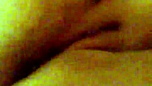 Mzslippery teases with her shaved pussy in front of the mirror