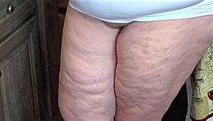 Big ass busty MILF with natural boobs in mini dress no panties flashes pussy in office close-up