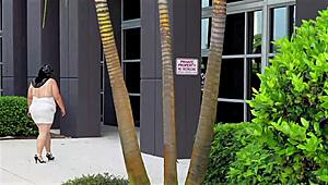 Big ass busty MILF with natural boobs in mini dress no panties flashes pussy in office close-up