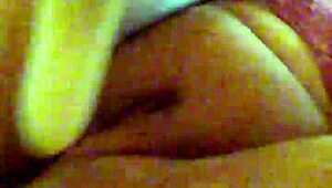 Mzslippery teases with her shaved pussy in front of the mirror