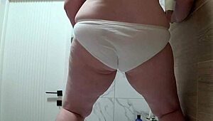 mature bbw pissing on white panties from below