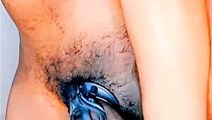 Mature woman standing in chastity cage with ripped clothes and thong