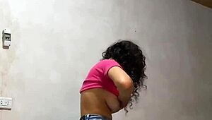 Hidden cam captures Colombian university babe undressing, her perfect body and big tits on display.