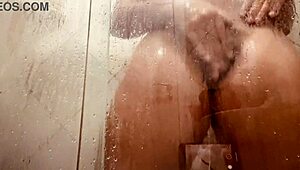 Girl being filmed while taking a shower showing off her hairy pussy