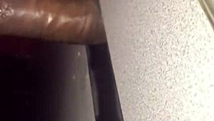 Homemade bbw amateur slut performs sloppy blowjob at gloryhole. She swallows cum from big black cock.
