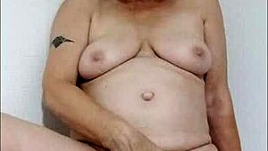 Hey, watch this dirty housewife wanking at home - feels so good!