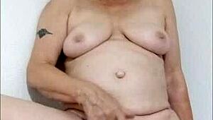 Hey, watch this dirty housewife wanking at home - feels so good!