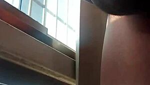 Hot guy with big dick masturbates publicly in front of the window