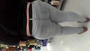 i am filming this chubby girl at the supermarket, she is walking the aisles and picking groceries