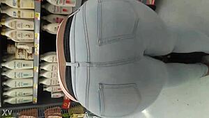 i am filming this chubby girl at the supermarket, she is walking the aisles and picking groceries