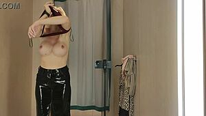 blonde tries on transparent latex outfits in public dressing room