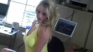 Sexy blonde teases with perfect tits during photoshoot.