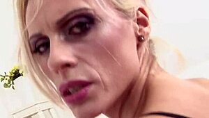 Watch this blonde milf getting her ass fucked by two big black cocks in an interracial threesome?