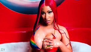 Nicki Minaj indulges in masturbation with her sexy big tits and nude redhead body.