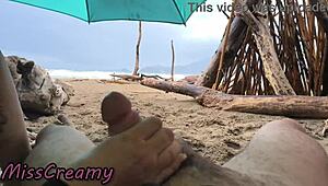 Imagine a public handjob on the stormy beach in 4K