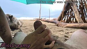 Imagine a public handjob on the stormy beach in 4K