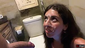 Cute girl feels excited eating burger with cum on face in public cafe