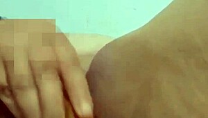 abuela playing with her big carrot in the bedroom