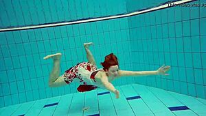 hot teen marketa dives underwater in bikini at beach