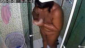 hidden cam catches busty bbw neighbor shaving her huge fat pussy in the bath