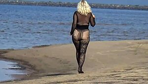 mature blonde teases big tits and ass flashing naturally on beach