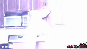 hey, check out sofie marie teasing her amazing milf tits in the kitchen