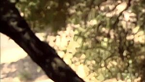 outdoor milf cougar fingers shaved pussy then straps on for lesbian anal assfuck between trees