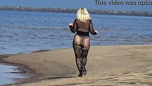 mature blonde teases big tits and ass flashing naturally on beach