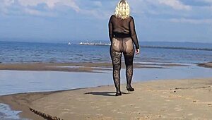 mature blonde teases big tits and ass flashing naturally on beach