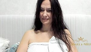 after her shower this horny Russian brunette milf fingers her hairy pussy clit and saggy big nipple tits craving young cock.