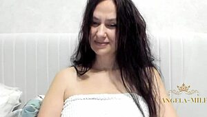after her shower this horny Russian brunette milf fingers her hairy pussy clit and saggy big nipple tits craving young cock.