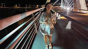 Luscious milf struts braless pantyless on bridge