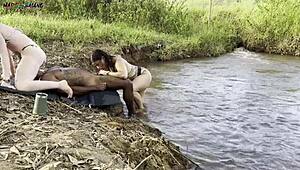 Sunbathing by the river sparks outdoor fun with two beauties sucking then filled up